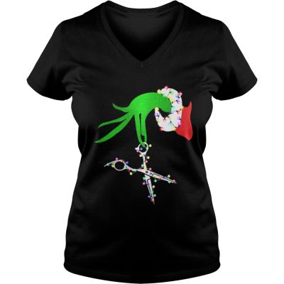 Grinch hand holds scissor hairstylist Christmas VNeck