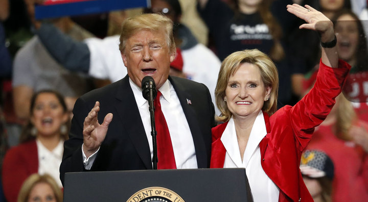 President Donald Trump encourages voters to support appointed Republican U.S. Sen. Cindy Hyde-Smith in a runoff race Tuesday against Democrat Mike Espy, as he speaks during a rally Monday, Nov. 26, 2018, in Biloxi, Miss. (AP Photo/Rogelio V. Solis)