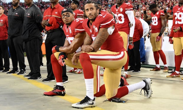 Colin Kaepernick, right, and Eric Reid of the San Francisco 49ers ‘take the knee’ in protest during a 2016 NFL game