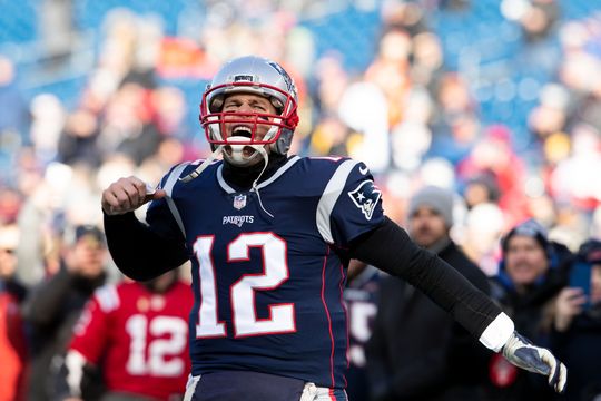 New England Patriots quarterback Tom Brady (12) reacts during warmups before a game against the Los Angeles Chargers in an AFC Divisional playoff football game at Gillette Stadium