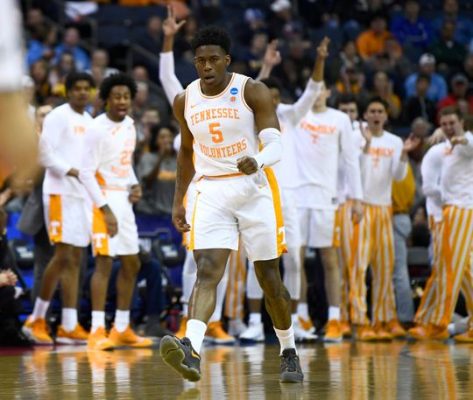 The Tennessee bench celebrates a 3-pointer by guard Admiral Schofield (5) during the first half Sunday