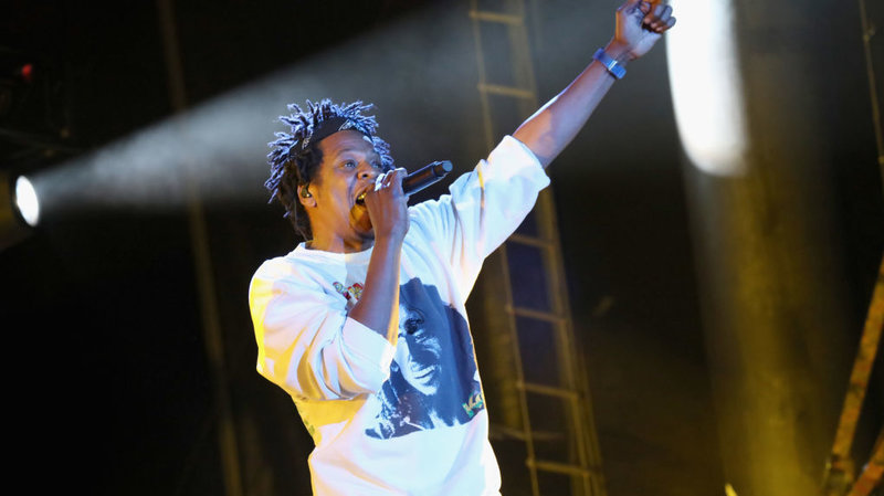 Jay-Z performs at the Something in the Water festival in Virginia Beach, Va., on Saturday. The rapper was one of the many artists who had been scheduled to perform at Woodstock 50