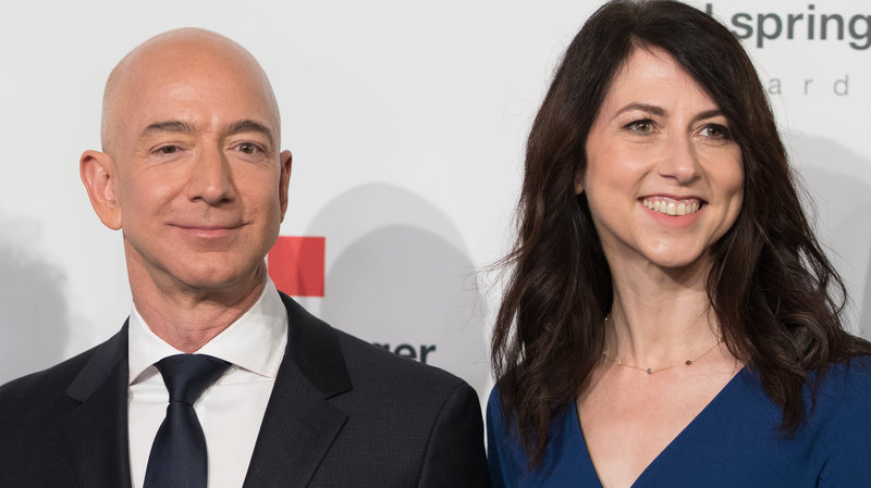 MacKenzie Bezos, one of the wealthiest women in the world, says she'll give at least half her fortune to charity. She's seen here in April 2018 with her now-former husband, Amazon founder Jeff Bezos