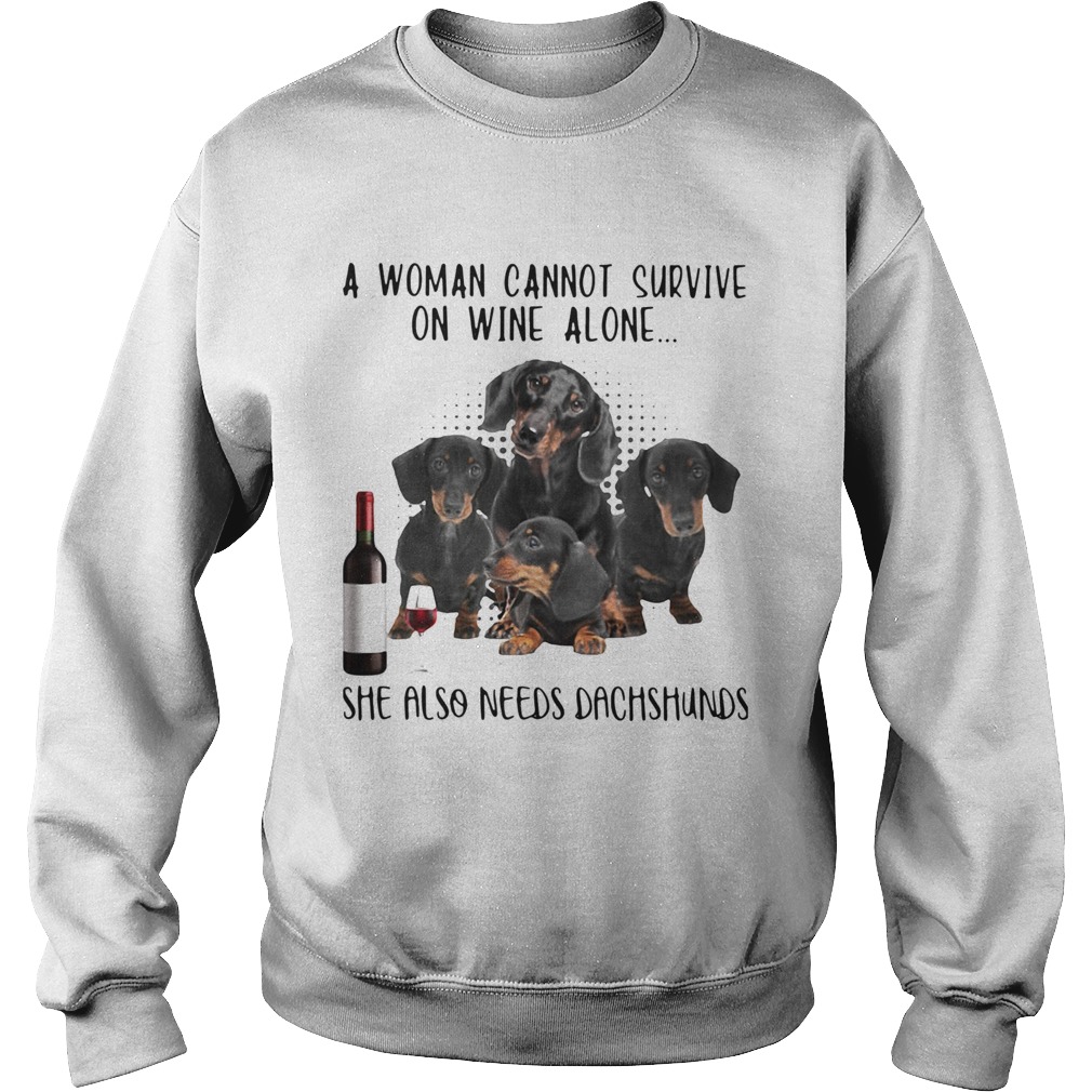 A Woman Cannot Survive On Wine Alone She Also Needs Dachshunds Sweatshirt