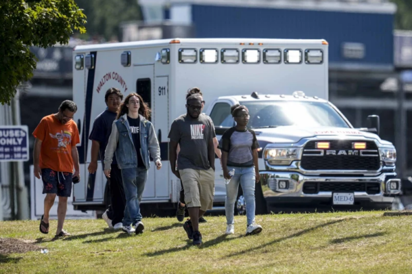 Students and parents walk off campus at Apalachee High School