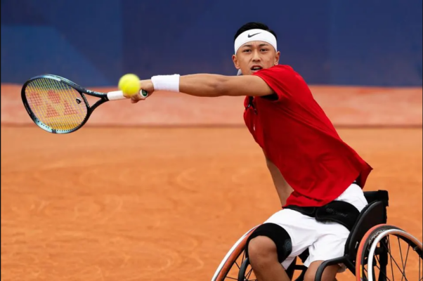 Tokito Oda from Japan plays a forehand against during the Wheelchair Tennis Men's Doubles